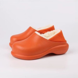 Orange leather winter slippers, thick sole, soft white lining, orange ribbed top.
