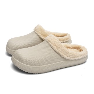A pair of gray slippers with a plush lining and textured exterior for added grip.
