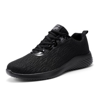 All-black knit casual sneakers with a sleek and minimalistic design, perfect for a stylish and comfortable look.