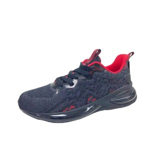 A dark grey and red lace-up sneaker with a black sole and camo pattern.