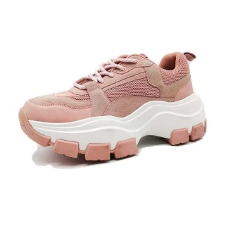 Side view of a pink sneaker with suede and mesh panels, white midsole, and pink chunky outsole.