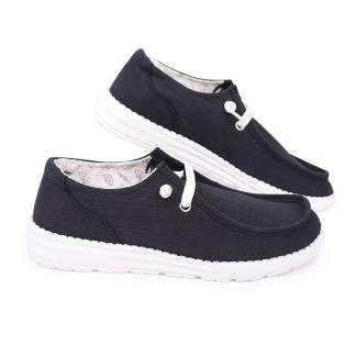 Pair of black casual slip-on sneakers with a white sole.