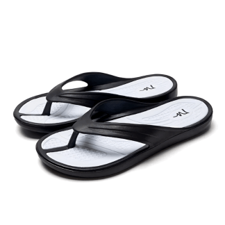 Classic black flip-flops with a white textured footbed and simple black straps, shown from above on a white background.