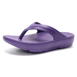 Vibrant purple flip-flops with a thong style, featuring a textured footbed and a chunky sole, presented on a plain background.